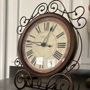 Brown and Black Ornate Wall Clock with Roman Numerals